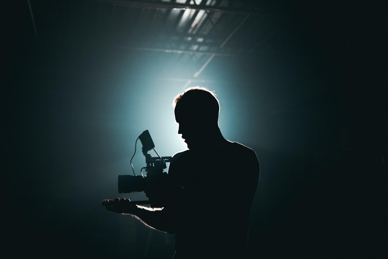 Accessibility 101 - An image of a man filming a scene in a film studio.